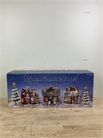 Christmas lighted metal houses in box