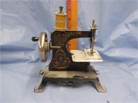 Antique tin child's sewing machine