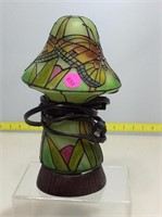 Green glass mushroom lamp with butterfly design.