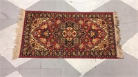 Red white and yellow hall rug