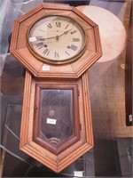 Vintage octagonal striking wall clock marked