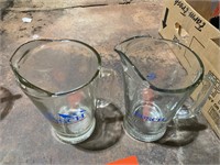 Two Busch beer pitchers