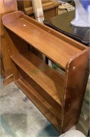 Backless wooden three shelf bookcase measures