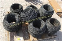 7 ROLLS OF USED BARBED WIRE