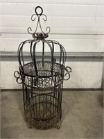 Antique iron ornate victims bird cage