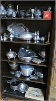 Contents of bookcase mostly silverplate