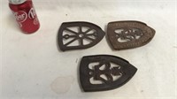 3  cast iron trivets