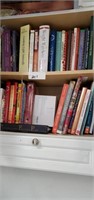 Cabinet of cookbooks plus or minus some