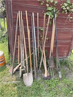 LOT OF HAND TOOLS INCLUDING AXES, RAKES, PITCH
