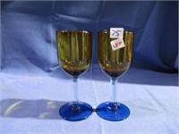 yellow and blue wine glasses .