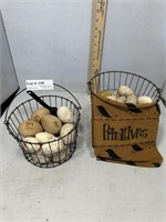 Two wire baskets with wooden dummy nesting eggs