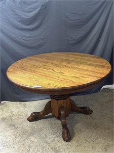 Oak claw footed pedestal dining table