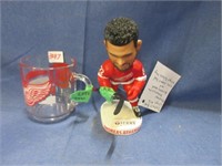detroit redwings bobble head and glass .