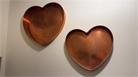 Two well-made copper heart-shaped cake pans,
