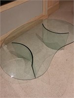 Bean shaped glass coffee table. Basement main