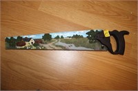WALL ART IN THE SHAPE OF A HAND SAW 21" LONG