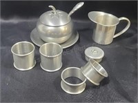 Pewter napkin rings, salt server and creamer qnd