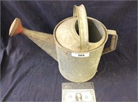 Vintage galvanized watering can