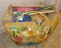 Basket with knitting supplies including needles,
