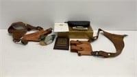 (2) Holsters, duck figurine. Plaque of US stamp,