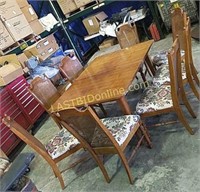 Wooden table and 8 cane back chairs