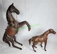 Two leather? wrapped horses
