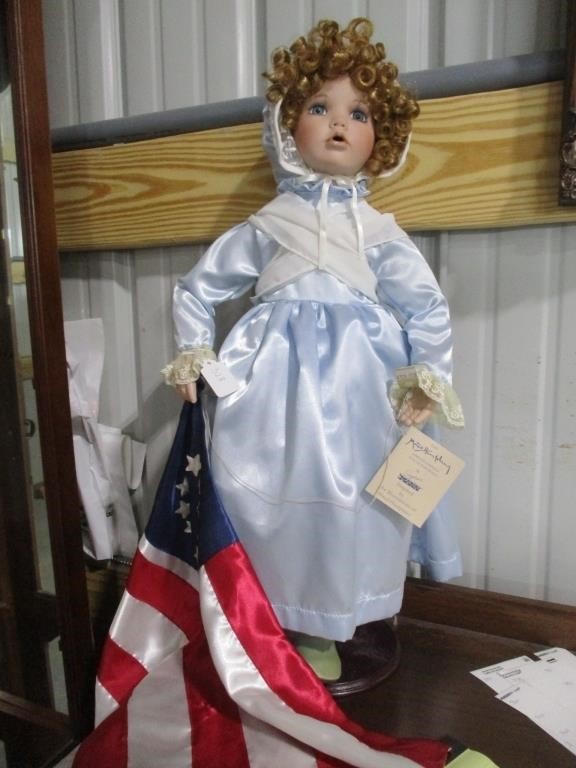 328-SEYMOUR  MANN PORCELAIN DOLL W/ FLAG