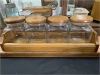 4 GLASS CANISTERS W/ WOOD LIDS & STAND -