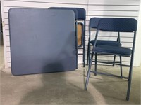 Card table and four upholstered folding chairs.