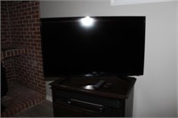 Fluid 42" television with LG sound bar, both with