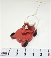Retro Red Plastic Lawn Mower Salt/Pepper-Moving