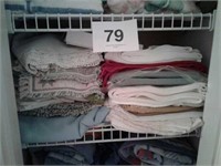 SHELF OF TABLE LINENS AND MORE
