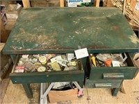 green metal desk with contents