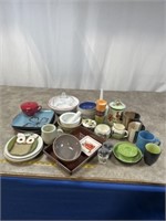 Assortment of coffee mugs, plates, bowls, serving