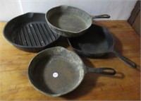 (4) Cast iron pans including Griswold #6, Wagner,