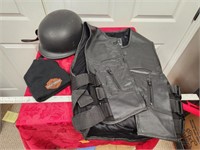 motorcycle helmet, leather vest and stocking cap