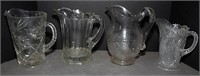 (4) pattern glass pitchers
