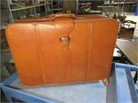 vintage tan suitcase with wheels