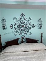 Decorative metal wall art displayed over a full