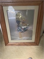 Prints of little girl in oak frame