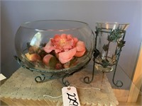 Metal stand with ivy holding large glass bowl of