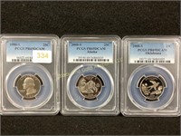 3 PCGS PR69DCAM slabbed clad quarters