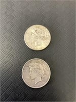 2 Liberty Head silver dollars.