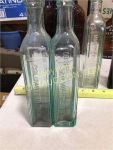 21 vintage glass bottles, many Warner bottling