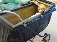 Antique baby stroller with baby doll