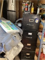 Black metal file cabinet with contents