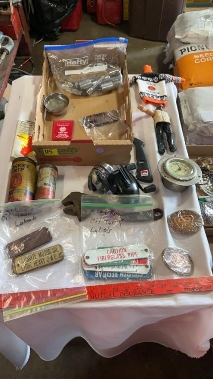 Vintage tin cans, fishing reels, clock (
