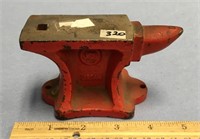 A red, 2 3/4" x 4 1/2", jewelers anvil    (g 22)