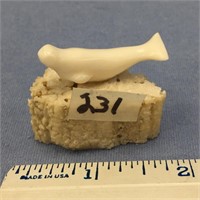 1 1/2" x 1" tall, ivory carving of a seal mounted
