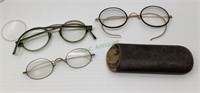 Three pairs of antique reading glasses and one